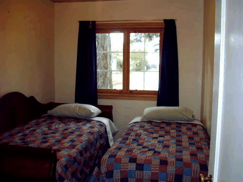 Picture of the west bedroom in the twin bed configuration.  Also available in a king bed
